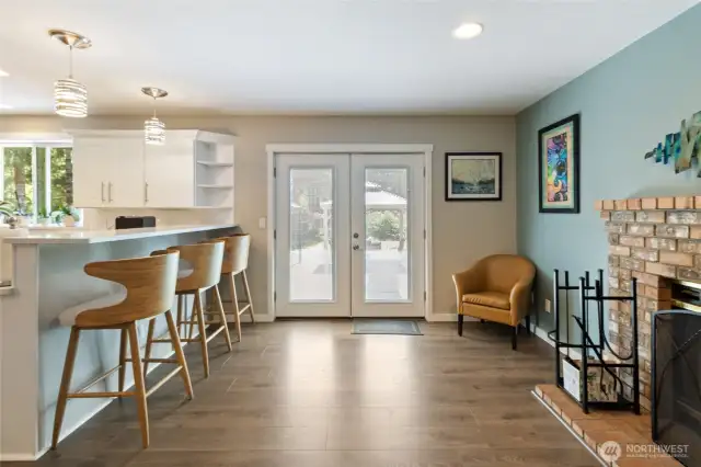 French doors lead to your backyard oasis.