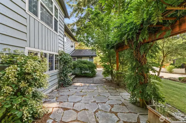 Beautiful foliage and landscaping surrounds the home, making you feel instantly at peace