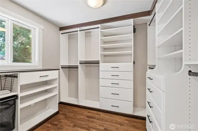 Have a place for every item with custom shelving and storage in the spacious walk in closet off of the primary suite