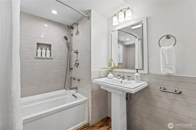 The lower level also features a second full bathroom complete with a bathtub for relaxing