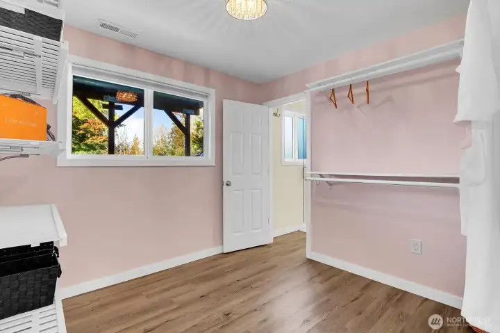 Walk-in closet off primary suite. downstairs.