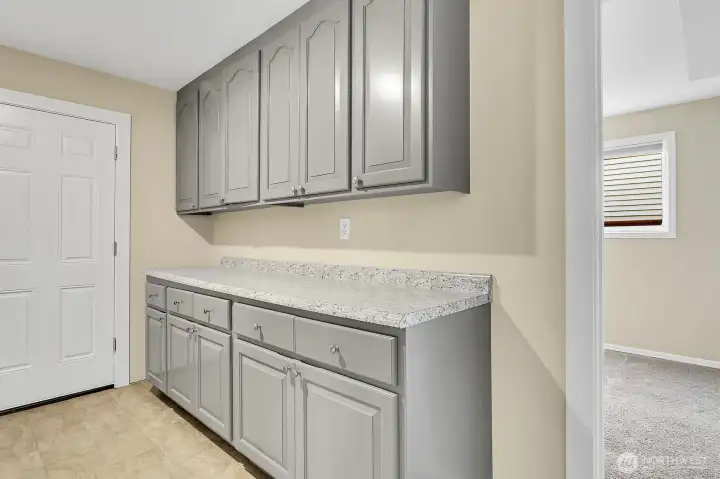 Plentiful cabinets in the laundry room.