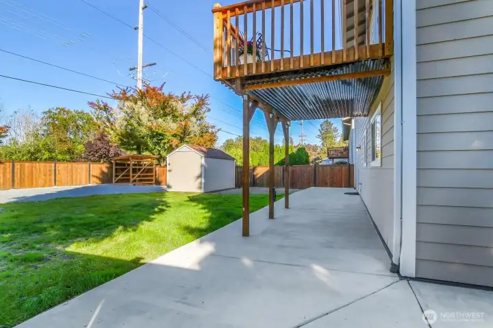 Patio wraps around the back and sides of home.