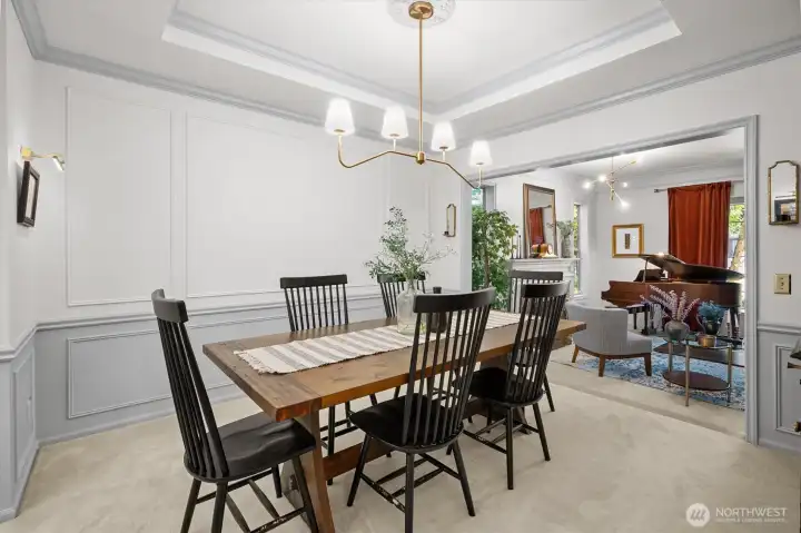 Dining room with detailed millwork and crown accents