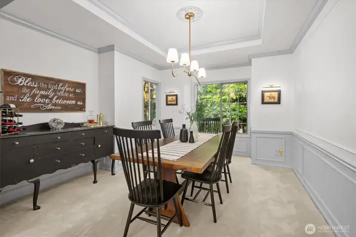 Dining room with detailed millwork and crown accents