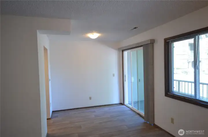 Dining area with slider leading to covered patio