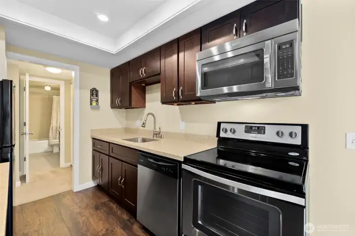 Updated cabinets, appliances, flooring and lighting.