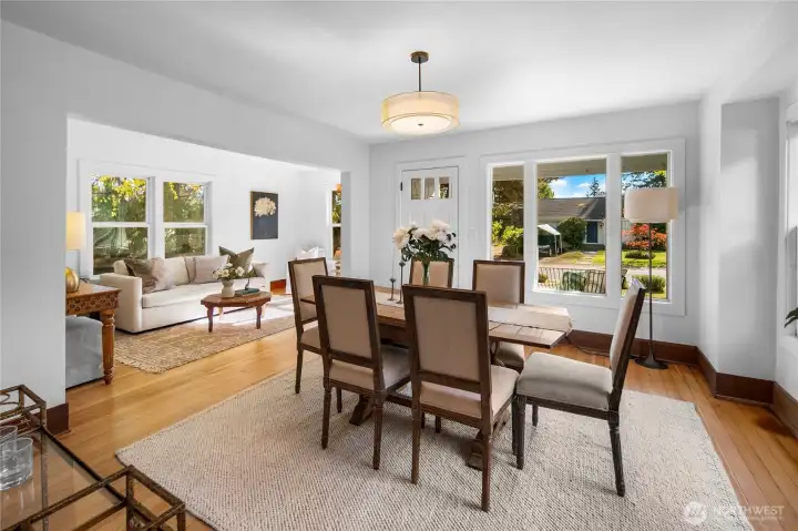 Looking back at the front door with dining and living rooms