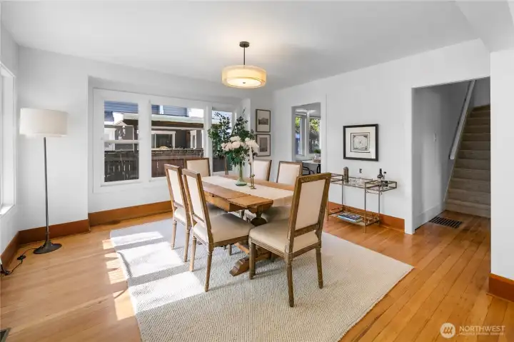 We've now come out of the kitchen and so let's head through the doorway to the right in this photo and take a quick look at the bathroom, main floor bedroom, and then head upstairs.