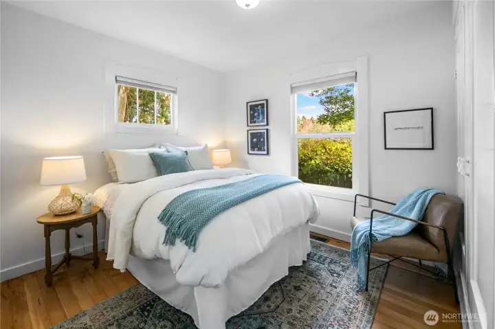 Before heading upstairs, you'll find this main floor bedroom. Once again noticed just how light and bright these rooms are.