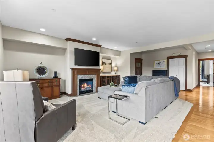 Oversized living room with plush carpet and gas fireplace