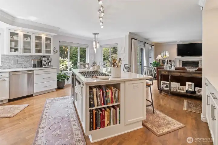 The kitchen offers versatile dining options to suit every occasion. A spacious island features a built-in eating bar, perfect for casual meals, morning coffee, or keeping the cook company while preparing dinner. Just steps away, an additional dining space provides a bright and inviting setting for family meals or entertaining guests, with plenty of room to gather and enjoy the heart of the home together.