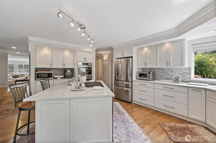 From another vantage point, the kitchen reveals its full sense of space and flow. Natural light streams through large windows.  Every detail has been thoughtfully designed to balance style, convenience, and comfort, making this kitchen a true centerpiece of the home.
