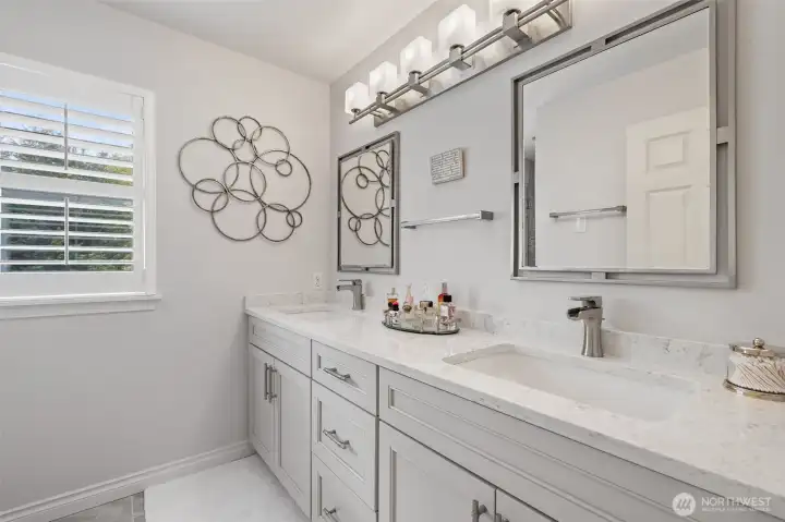 The upstairs shared bathroom is thoughtfully designed for both style and convenience. Featuring dual sinks, it provides ample space for family members or guests to get ready comfortably. Elegant finishes, a bright and airy layout, and well-planned storage make this bathroom both functional and inviting, perfectly complementing the home’s overall design.