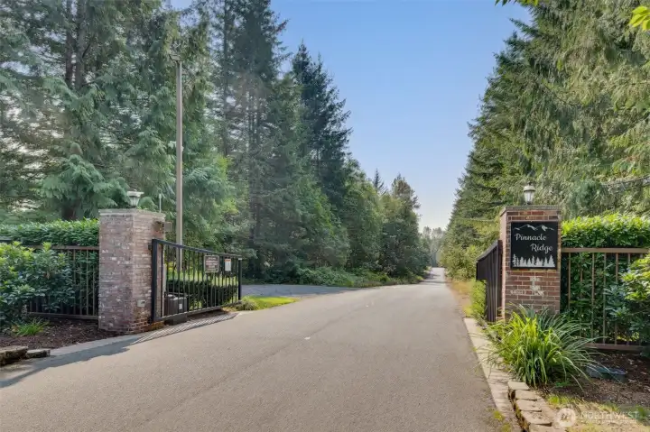 The gated entrance to Pinnacle Ridge sets the tone for the community’s elegance and exclusivity. Grand gates open to a beautiful, private community, lined with mature trees and manicured greenery, creating a welcoming yet private approach. The entrance conveys a sense of security, prestige, and refined living, offering residents and visitors alike a distinguished first impression of this sought-after neighborhood.