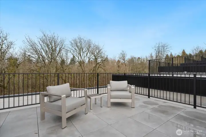 Rooftop retreat with space to lounge, entertain, and take in the views of Downtown Bellevue and Seattle skyline