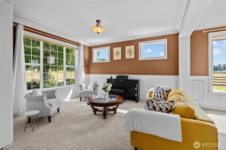 High ceilings and crown molding accentuate the wonderful living room!