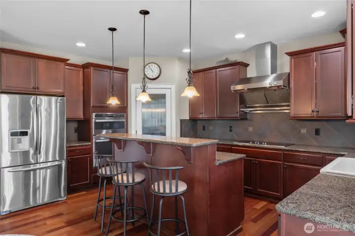 The kitchen has so much storge inside the gorgeous cabinetry and pantry