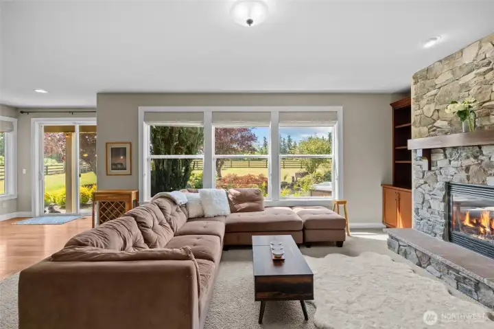 Large windows invite abundant natural light while beautifully blending the home’s interior with its outdoor setting.