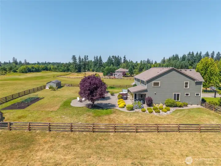 The spacious grounds are thoughtfully landscaped, blending natural beauty with refined design