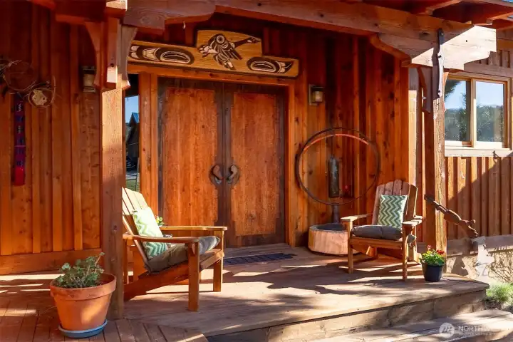 Artistic details from the hand-carved doors to the hand rail carved in the form of an extended hand... the love and artistry poured into the creation of this home is layers deep.