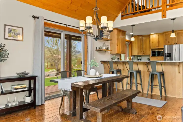 Sliding doors lead to a covered deck, easily bringing inside entertaining outside.