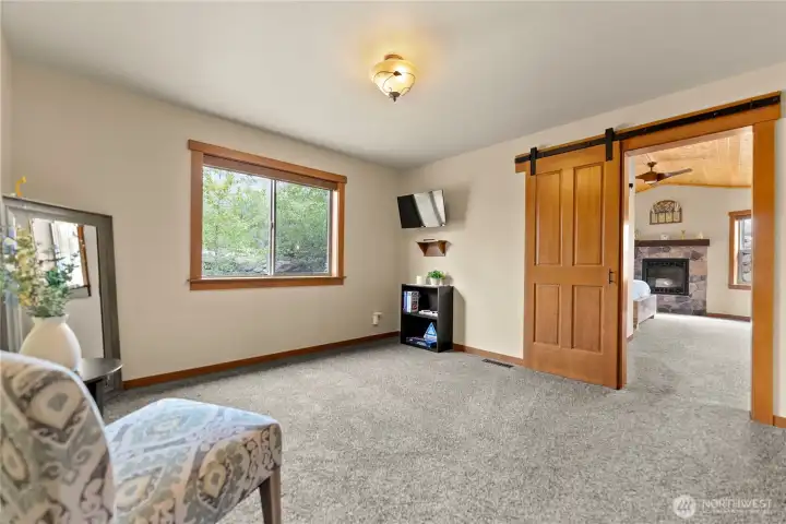 Anteroom to primary bedroom can serve as a work out space, office, reading room, nursery, or craft room.