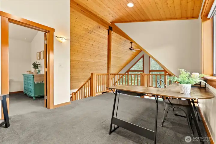 Loft area is versatile for a workout space, office area, TV space, gaming area, or play area.