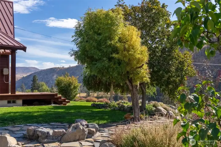 Shade from established, visually attractive trees enhances the beauty of the landscaping.