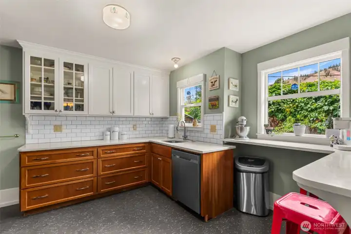 Kitchen windows and dining nook make this kitchen so welcoming.