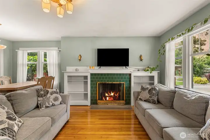 Beautiful tile fireplace with built ins. Antique working sconces add the perfect touch.