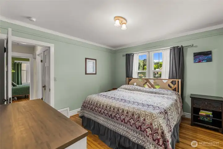 Primary Bedroom. Beautiful hardwood flooring.