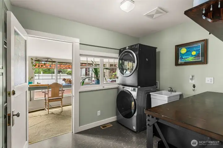 Laundry Room with wash sink and laundry table.