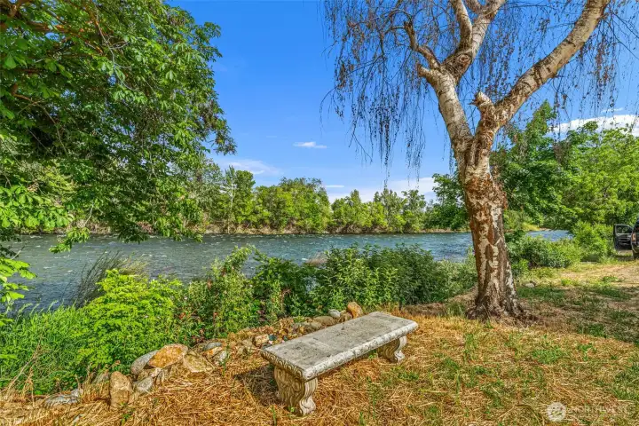 Bench straight across from house, set by owners and perfectly placed to enjoy the sounds and view of the river.
