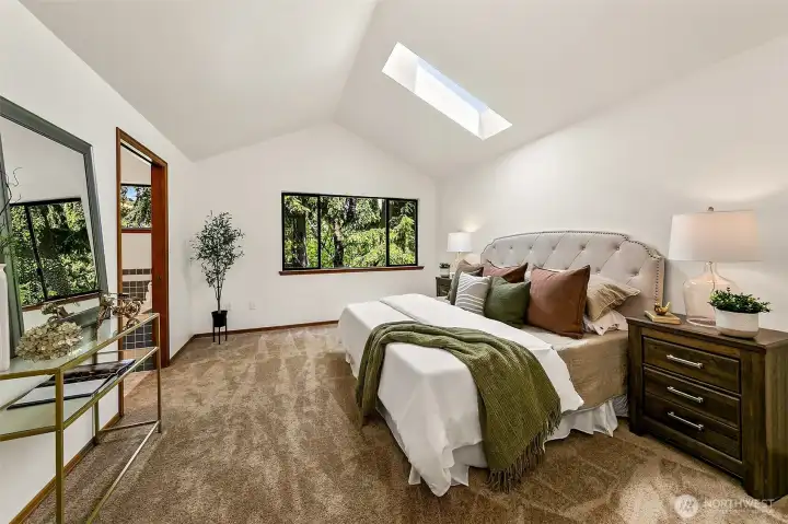 Privately positioned above the main living areas, the primary suite offers separation, quiet and generous proportions.