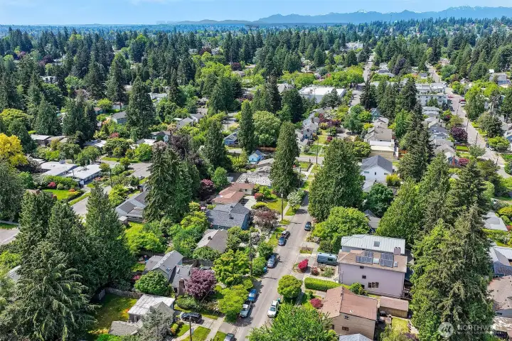 The neighborhood functions as an extension of the property itself, offering access to schoolyards, sports fields, beaches, bike trails and recreation facilities that far exceed what most private yards can provide.