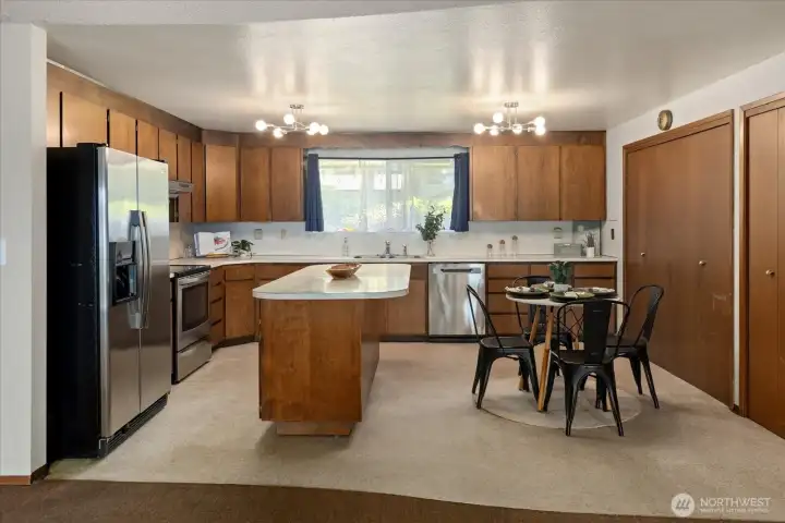 Kitchen with a free-standing island. Kitchen with a free-standing island.