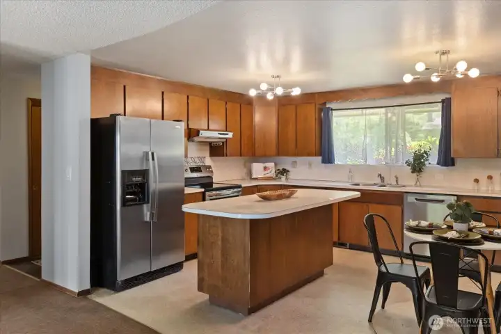 Kitchen view, hallway leads to foyer. Kitchen view, hallway leads to foyer.