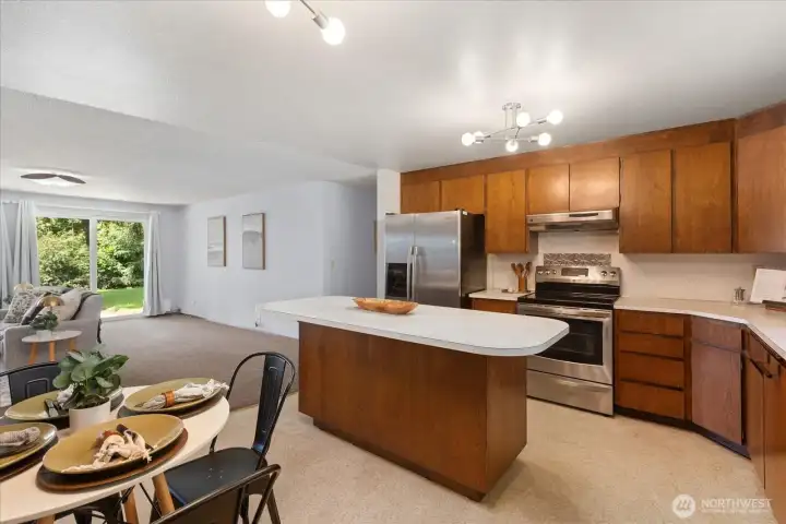 Beautiful free-standing kitchen island, with view into the living room and backyard. Beautiful free-standing kitchen island, with view into the living room and backyard.