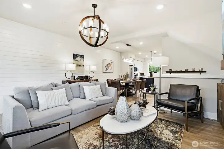 Shiplap feature wall extends from the living room through to the dining room.