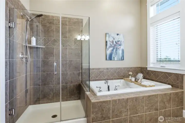 Primary bath with tiled soaker tub, walk-in shower