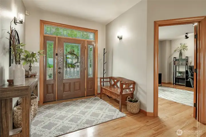 Beautiful entry with office to the right and dining room to the left. Hardwood floors throughout main living area. Beautiful entry with office to the right and dining room to the left. Hardwood floors throughout main living area.
