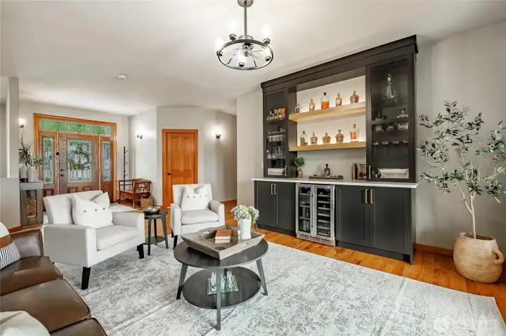 Sitting room with new bar style cabinets and beverage fridge. Great place to entertain and visit with friends. Sitting room with new bar style cabinets and beverage fridge. Great place to entertain and visit with friends.