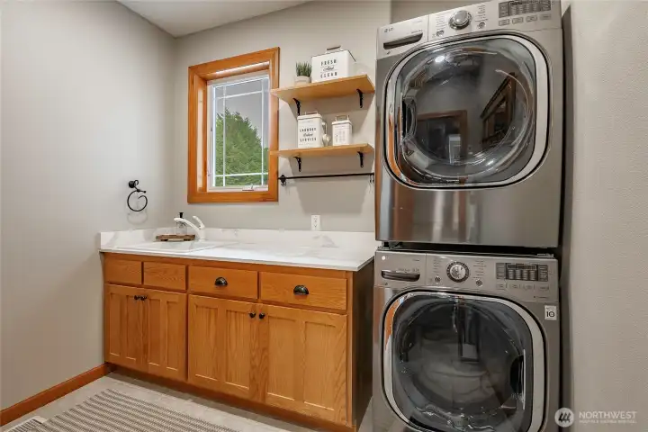 Laundry room includes the almost new washer and dryer. Laundry room includes the almost new washer and dryer.