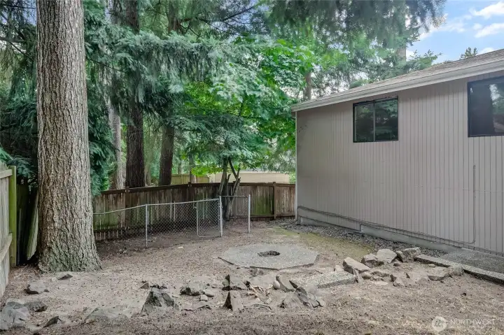 Rear of home, dog run and fire pit Rear of home, dog run and fire pit