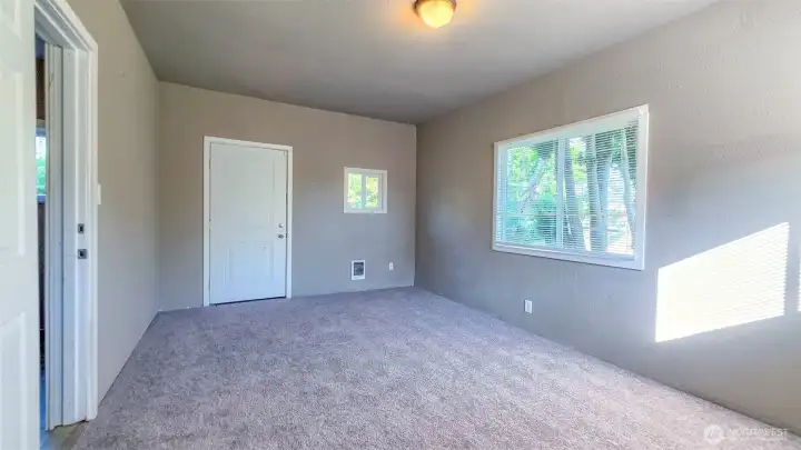 Other view of LG bedroom at back of home (has it's own door to exit/enter from outside