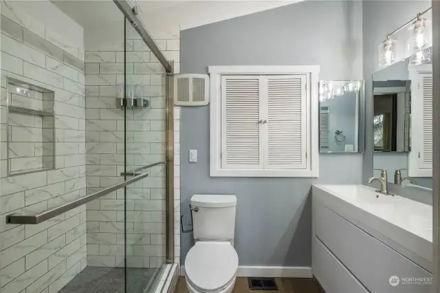 Beautiful updated bathroom with large shower in primary.