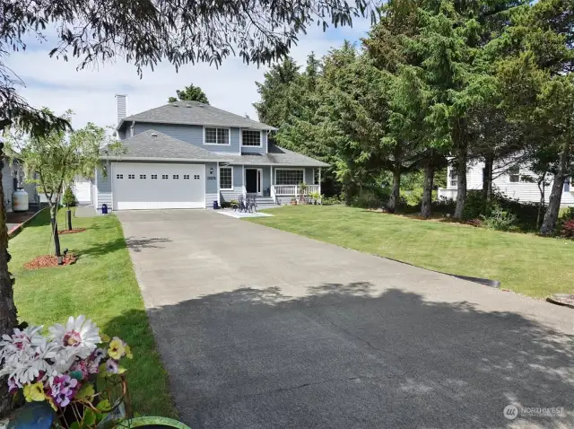 Large Concrete Driveway leading to the 2-car Garage.