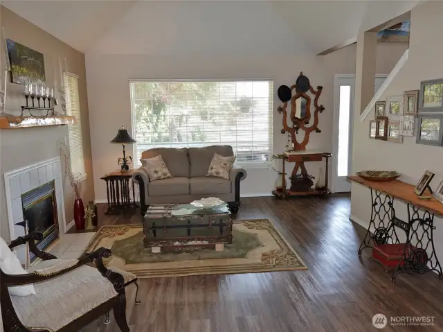 Living Room w/ hip-styled vaulted ceiling.