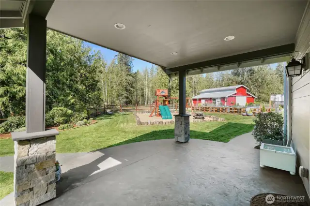 Keep the rain or sun off under the large  backyard covered patio.